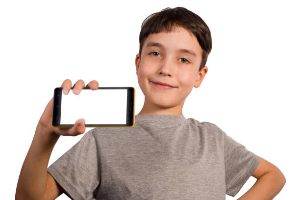 istock Cute boy with smartphone on white background 1338701689