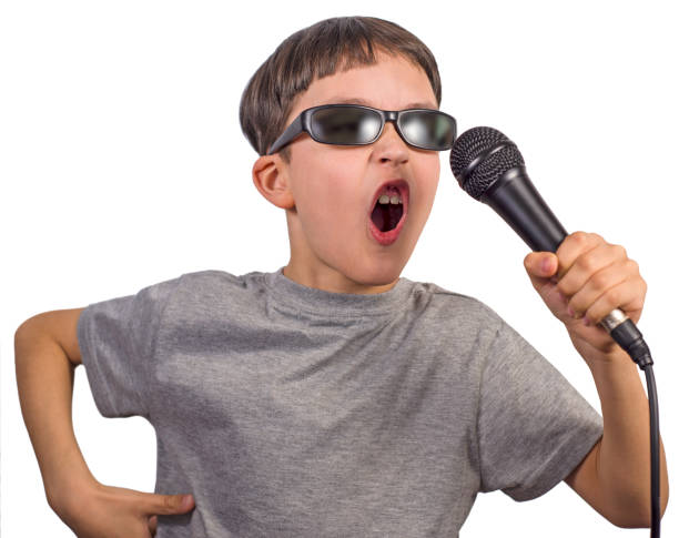istock Cute boy posing as a rockstar on white background 1338701702