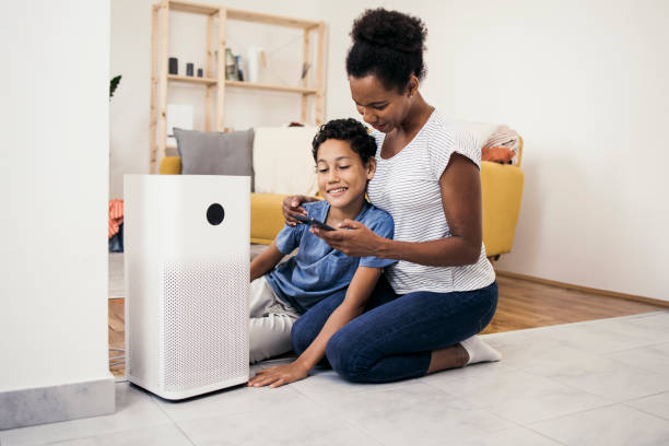 istock African American and her boy woman using a smart system at their house 1338702566