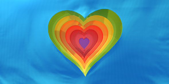 Heart textured with LGBTI flag on white background. Horizontal composition with copy space.