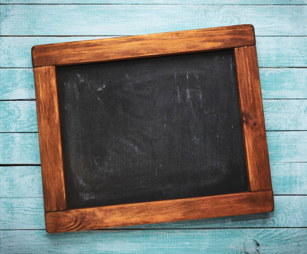 istock Aged wooden blackboard on rustic background 1338705971