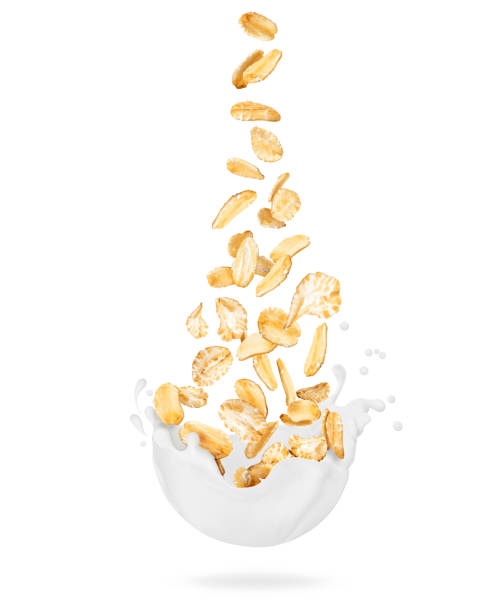 istock Cereals are falling into milk splashes isolated on white background 1338706123