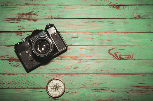 Vintage photo camera  on wooden background