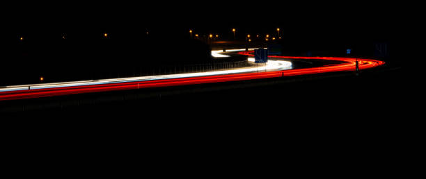 istock lights of cars with night. 1338708410