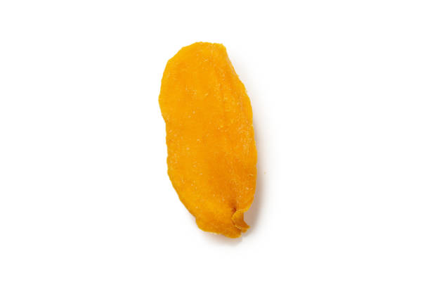 istock Dry tasty mango slices isolated on a white background. 1338708650