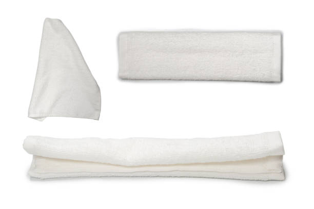 istock White fluffy cotton towel isolated on a white background. 1338708722