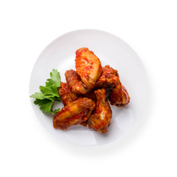 istock chicken wings in barbecue sauce on white plate isolated on white background top view 1338709049