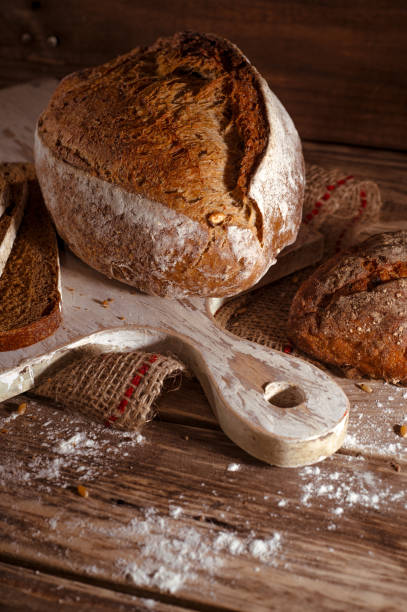 istock Homemade healthy whole grain bread on rustic wooden background 1338711069