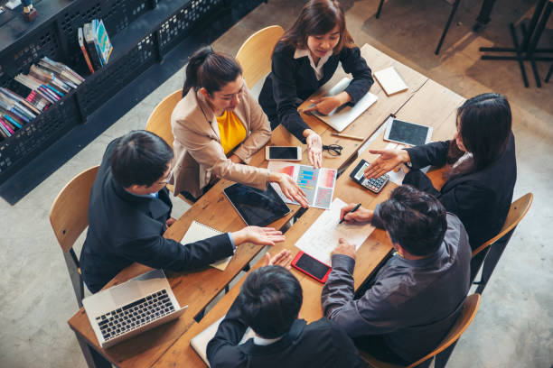 istock Group of business people plan annual budget report and work to solution strategy during brainstorming meeting. Collaborate of Professional Businessman and team at office. Strategy Business concept 1338712316