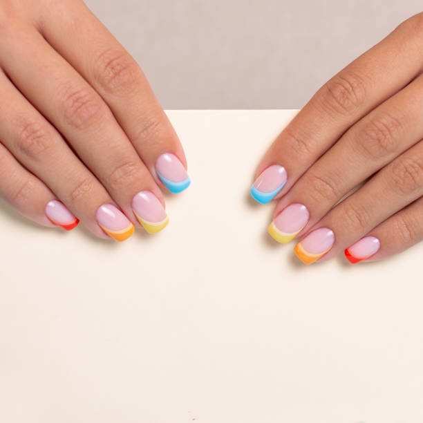 istock Female hands with colourful manicure nails 1338714518