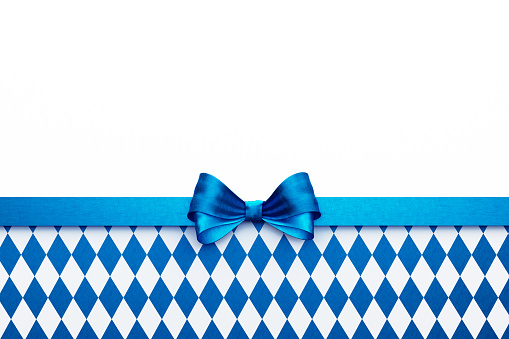 Blue ribbon sitting over blue and white checkered background. Horizontal composition with  copy space. Beer Fest concept.