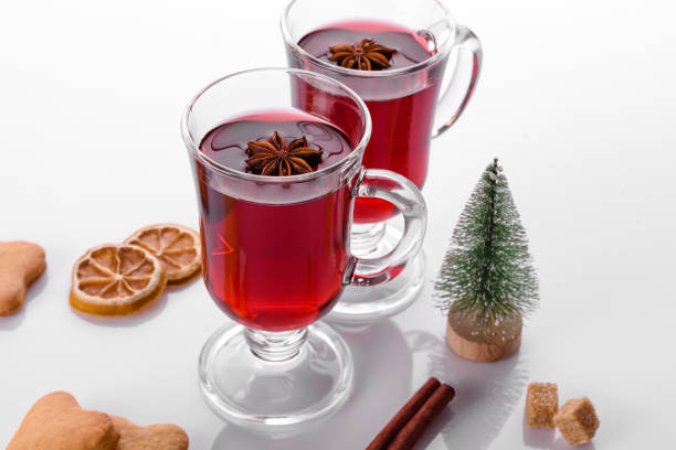 istock Hot red mulled wine isolated on white background with christmas spices 1338716526
