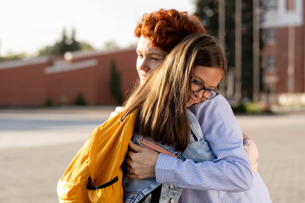 istock Young woman seeing off her youthful daughter with backpack 1338720147