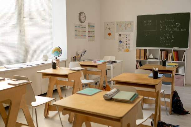 istock Large classroom in contemporary school with rows of desks 1338720219