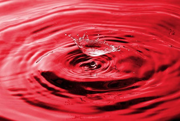 istock Red drop of water and splash 133872041