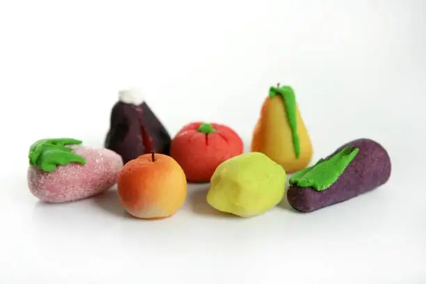 Photo of Variety of fruits on colorful marzipan