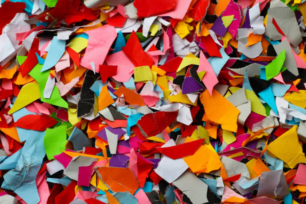 istock Torn small pieces of multi-colored paper, 1338721688