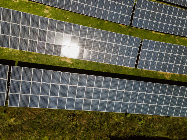 istock Sustainable source of energy - Solar panels on green hill 1338722595