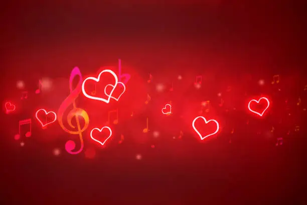 Photo of glowing notes and hearts on red background with bokeh