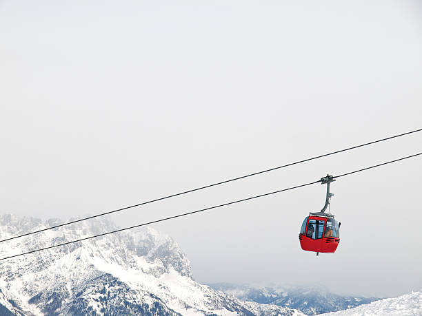 red ski lift red ski lift, in the Wilder kaiser (Austria) overhead cable car stock pictures, royalty-free photos & images