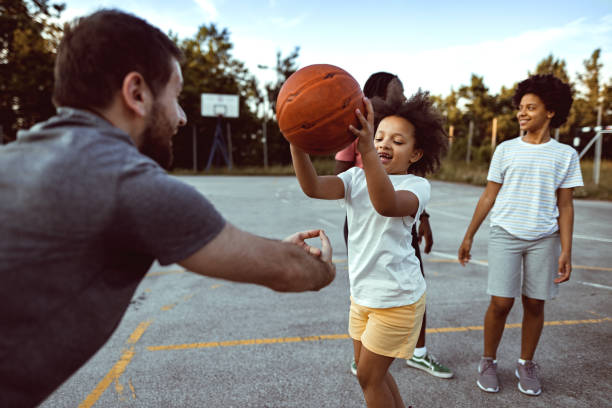 istock Family playing basketball 1338726509