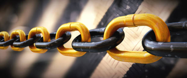 istock Extreme close up on a multi-colored chain on a highly defocused metal grates background. Wide horizontal composition. 1338727689