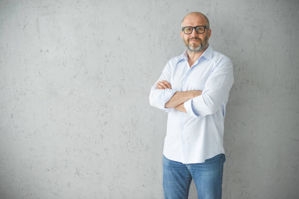 istock mature adult man ( gray background) 1338728330