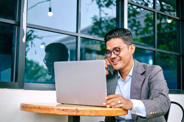 istock Senior Executive Man Talking on The Phone and Using Laptop for Business Discussion 1338728994