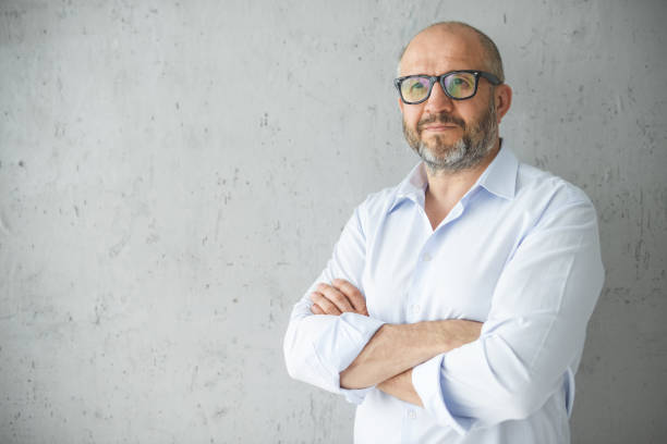 istock mature adult man ( gray background) 1338729147