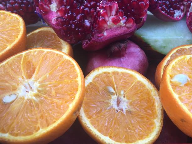 istock apple orange cut orange organic fruits 1338730456