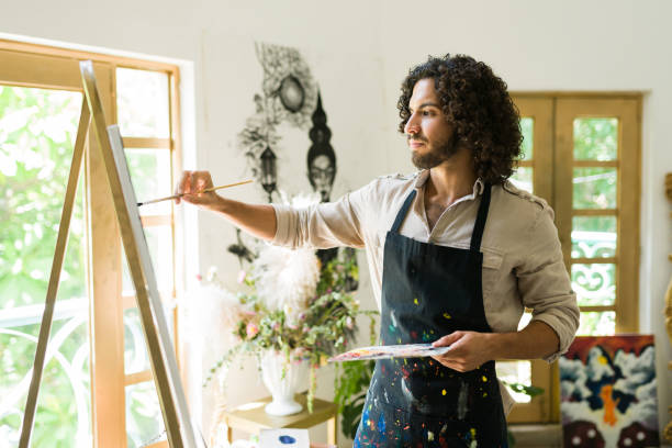istock Latin painter doing an oil painting 1338733725