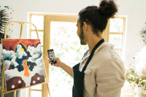 istock Talented artist posting on social media 1338734067