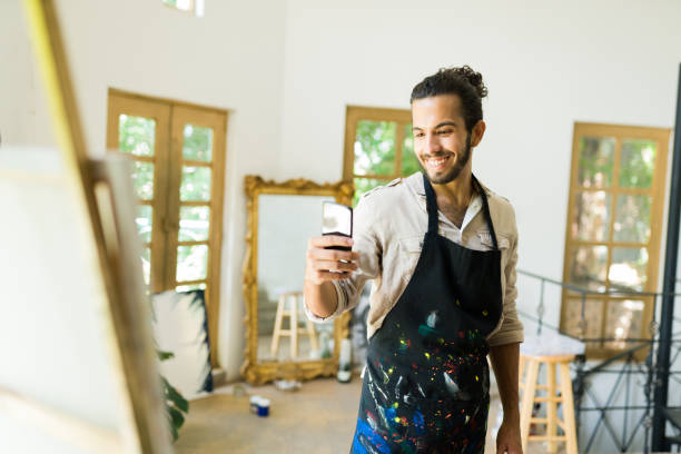 istock Handsome artist feeling proud of his work 1338735158