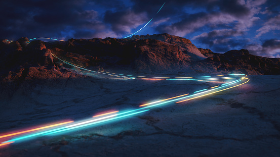 A mysterious light trail descending a mountain slope
