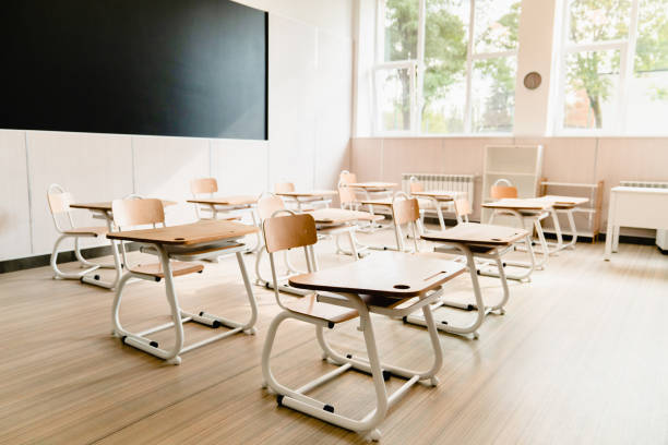 istock Empty modern classroom at school university college. Lockdown quarantine pandemic Covid19 coronavirus concept. School is closed. 1338736463