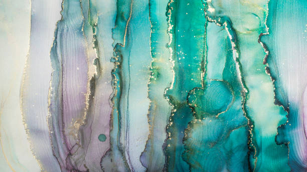 luxury abstract painting in fluid art technique.transparent vertical layers of green, blue, purple and gold paints create marbled texture of stripes, swirls and veins with glowing gold and glitter. - textured stone gray green imagens e fotografias de stock