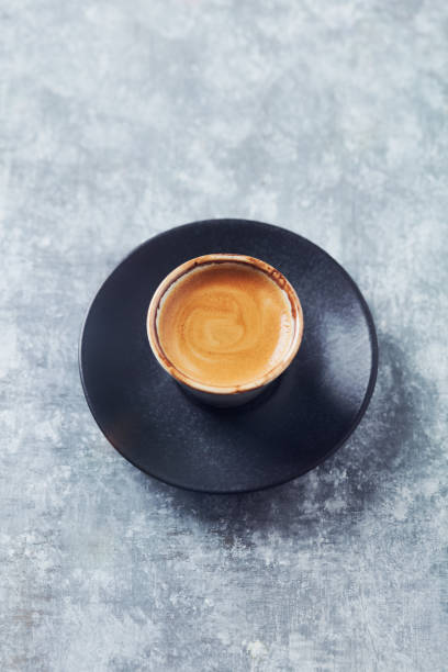istock Cup of coffee on bright wooden background. Copy space. 1338739120