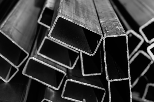 Metal pipes made of rectangular profile in a commercial warehouse