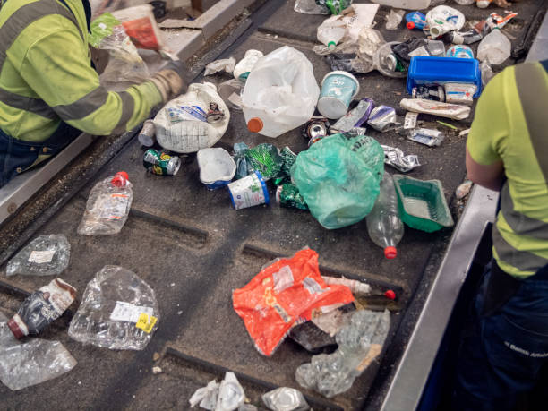 istock Conveyor belt in a waste management plant 1338741964