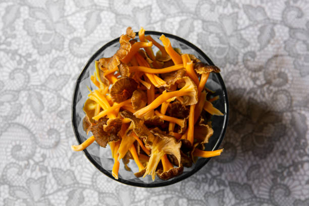 Craterellus lutescens or Cantharellus lutescens or Cantharellus xanthopus or Cantharellus aurora, commonly known as Yellow Foot, is a species of edible mushroom. Heap in bowl in home kitchen.