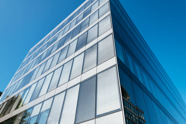 istock Office building exterior in financial district, low angle view 1338744328
