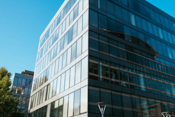 istock Office building exterior in financial district, low angle view 1338744410