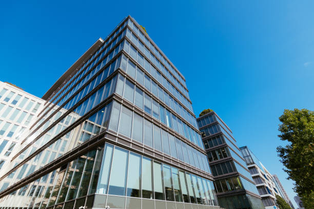 istock Office building exterior in financial district, low angle view 1338744680