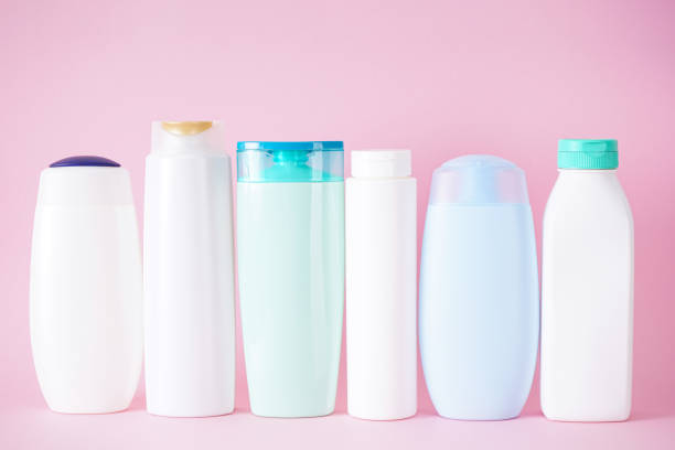 istock Plastic bottles for body care and cosmetics on a pink background. 1338744702