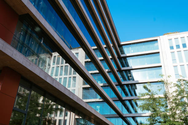 istock Office building exterior in financial district, low angle view 1338744894