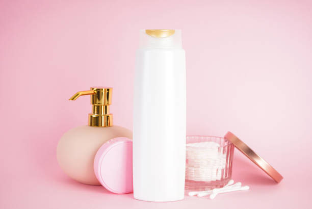istock Shampoo bottle, soap dispenser on a pink background. 1338745570