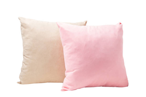 istock Two pillows in pastel colors isolated on white background 1338746866