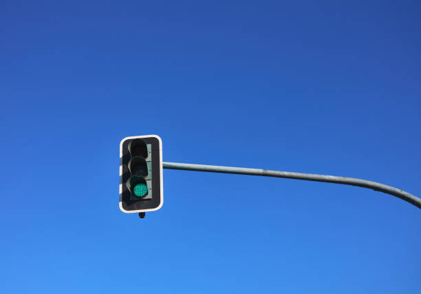 istock traffic light with green light on with blue sky in the background 1338747999