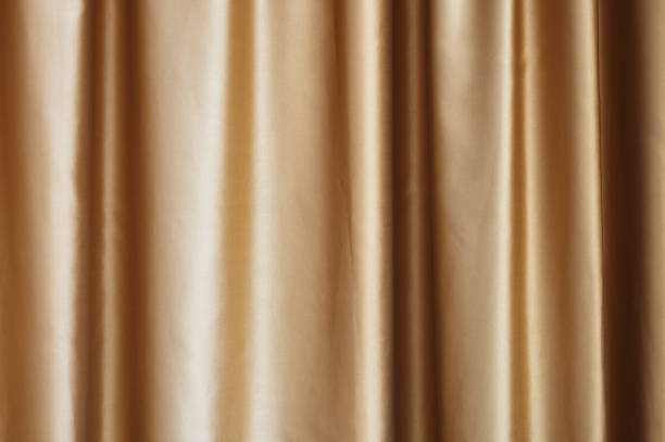 golden fabric curtain with pleats