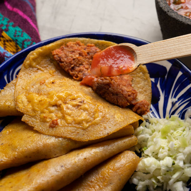 istock Mexican food. Steamed tacos also called de canasta on grey background 1338756151